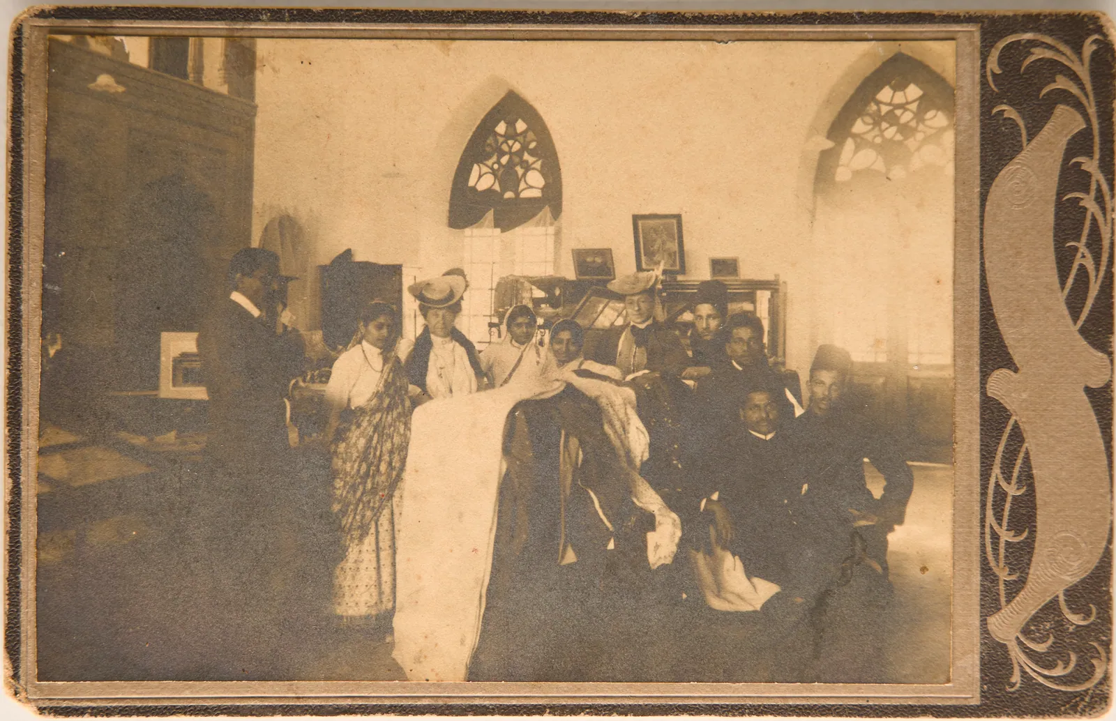 A.R. Siqqiqui with others including two European women possibly in a clothes or charity shop