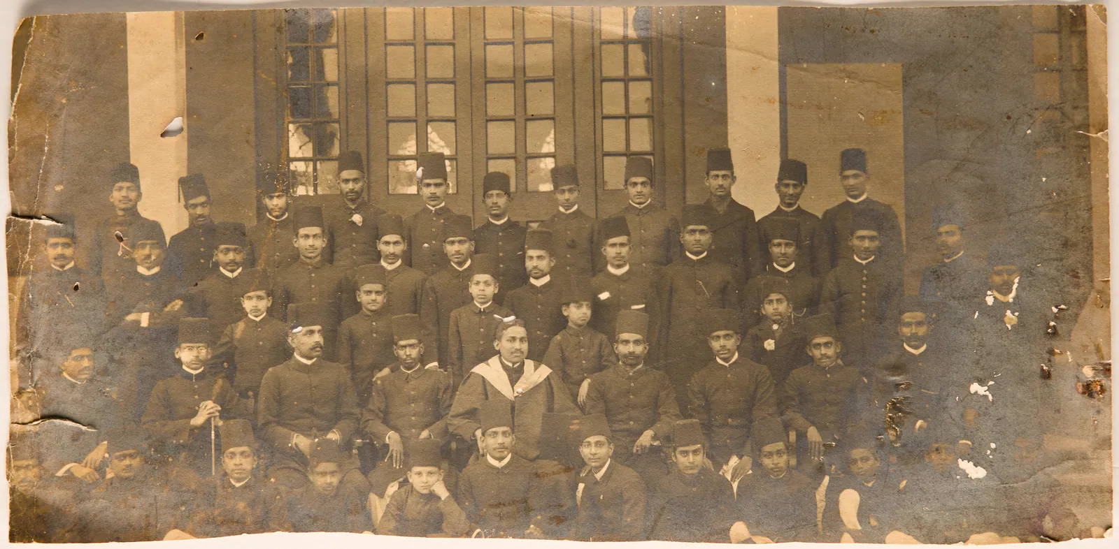 A.R. Siqqiqui in graduation gown with other students and faculty