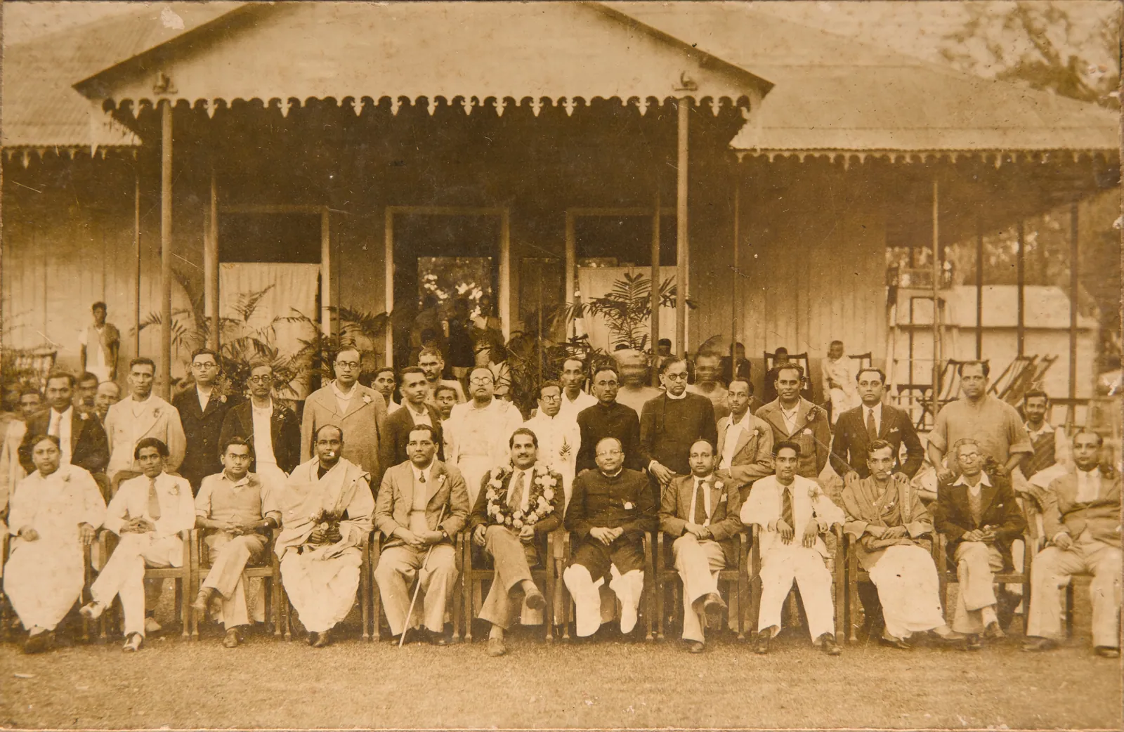 Station Club Bogra 6.1.1947. J K Gupta Roy, Secretary Station Club. Ali Asghar Pakistan Civil Service officer, garlanded in centre