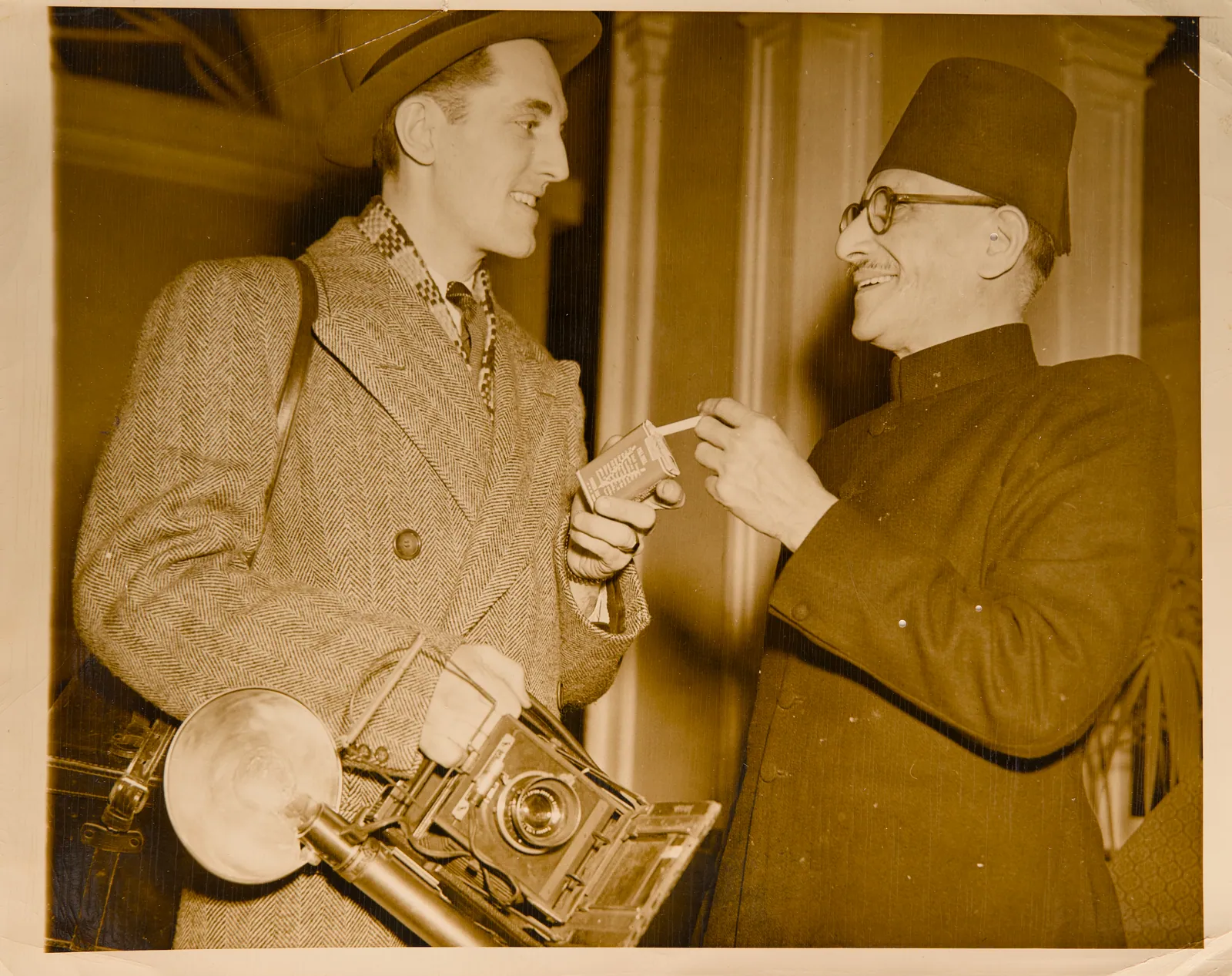 Abdur Rehman Siddiqui sharing a cigarette with a journalist
